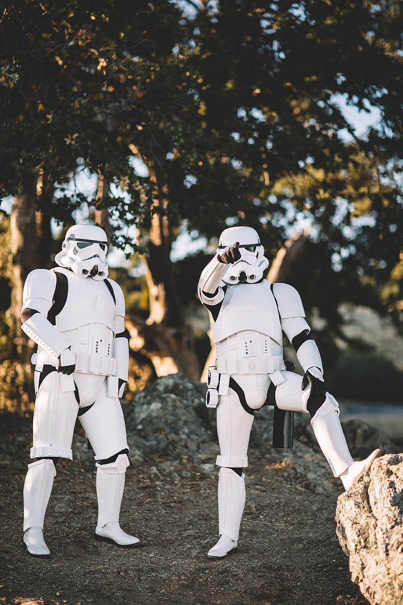 two Star Wars Stormtrooper action figures on gray surface outdoors, HD phone wallpaper