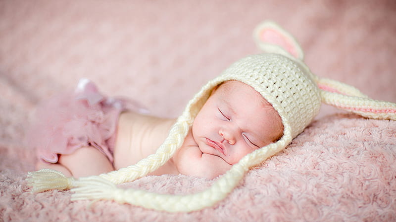 Cute Baby Child Is Sleeping On Light Peach Fur Cloth Wearing Woolen Knitted Cap In Blur Background Cute, HD wallpaper