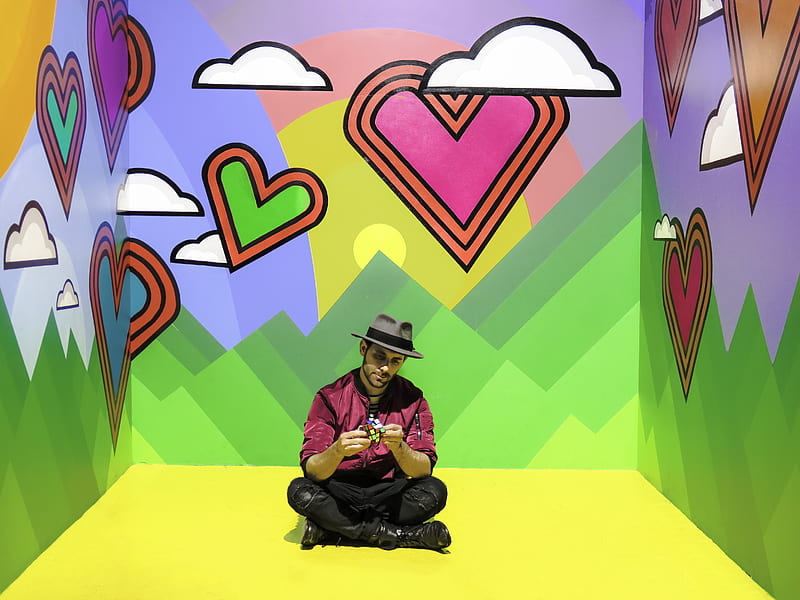 man sitting on multicolored 3D room, HD wallpaper