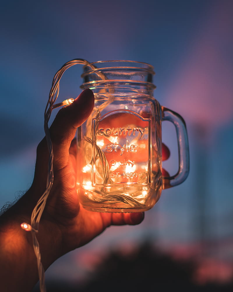 person holding jar with lighted string lights, HD phone wallpaper