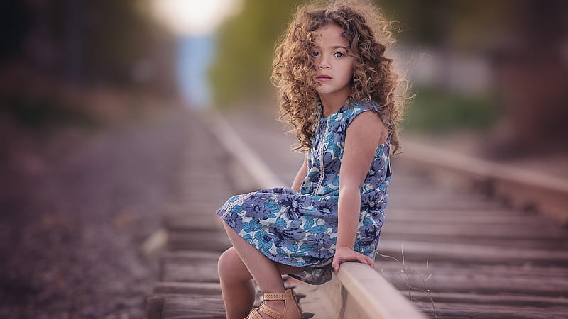 Curly Hair Cute Little Girl Is Sitting On Railroad Wearing Flower Printed Dress Cute, HD wallpaper