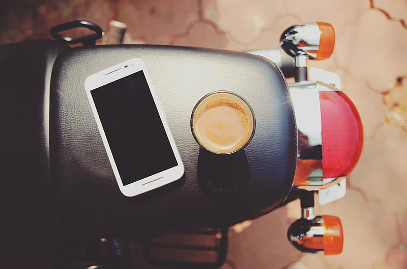 white smartphone on black leather motorcycle seat, HD wallpaper