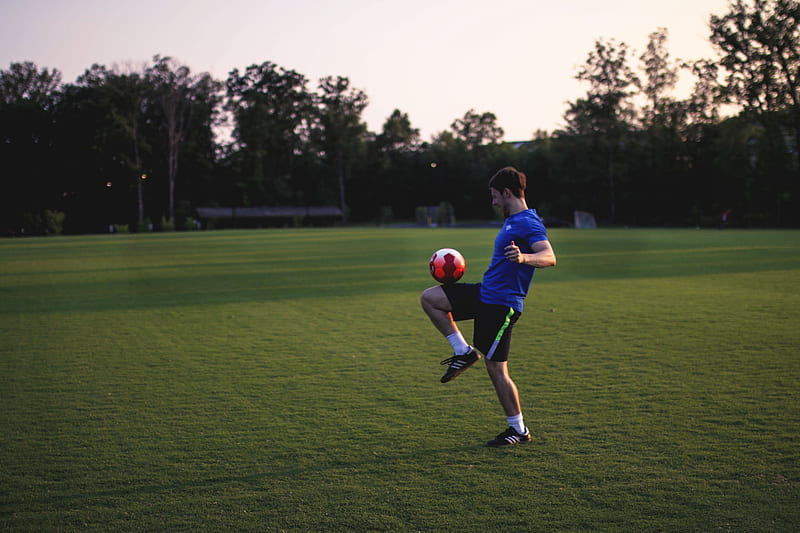 man juggling ball on grass field, HD wallpaper
