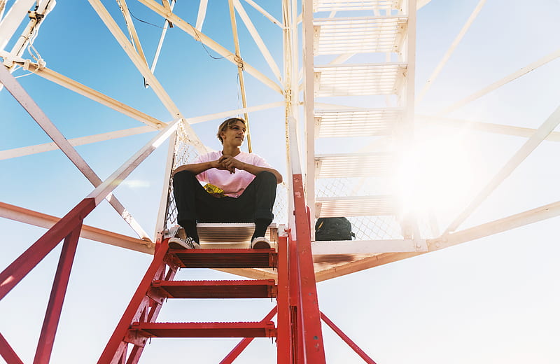 HD wallpaper: man sitting on stairs with red Louis Vuitton X