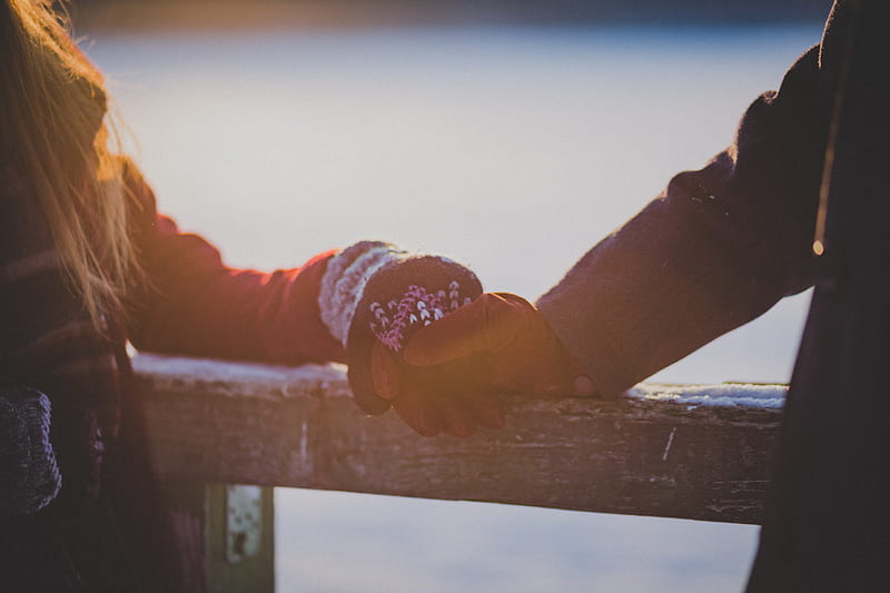 On a winter's day, young lovers hands touch on a cabin railing, HD wallpaper