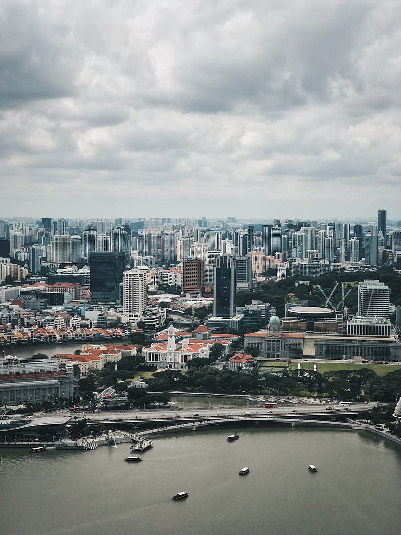 city buildings under dramatic clouds during daytime, HD phone wallpaper