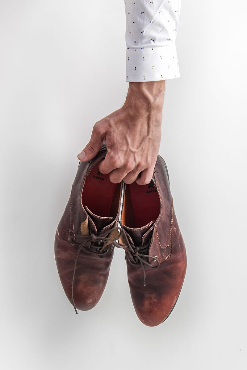 person holding pair of brown leather shoes, HD phone wallpaper