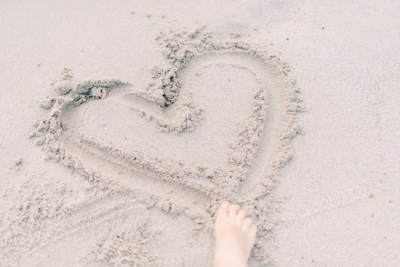 person forming heart on sand using right foot, HD wallpaper