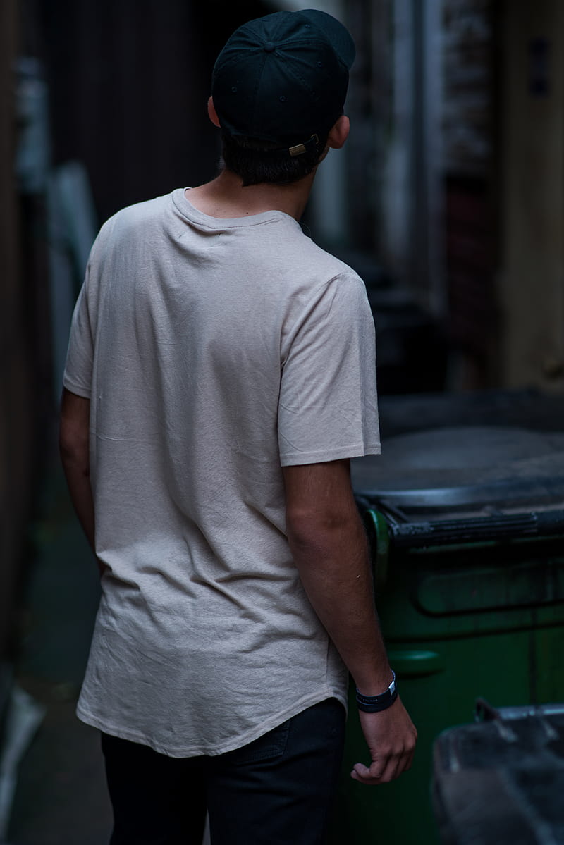 man wearing white shirt beside wheelie bin, HD phone wallpaper