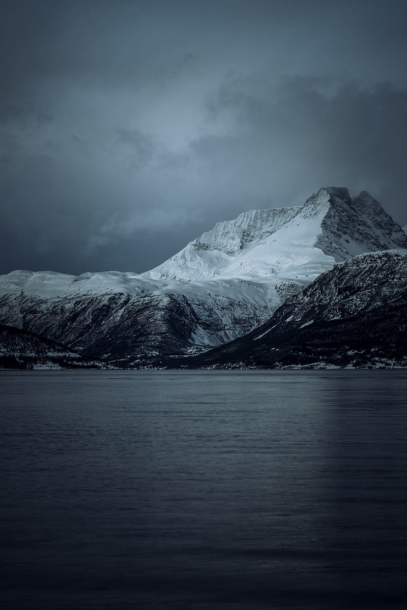 Snow-covered Mountain Facing Body of Water Under Heavy Clouds, HD phone wallpaper
