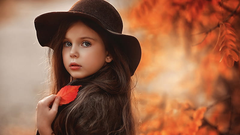 Cute Little Girl Is Wearing Black Overcoat And Hat Standing In Blur Autumn Leaves Background Cute, HD wallpaper