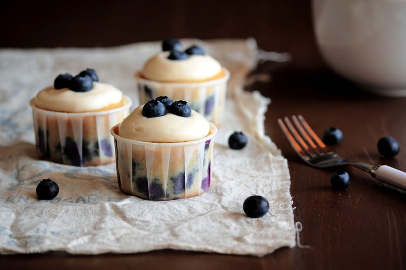 Burst of Blueberriness, orange, linen cloth, circular, shadow, blueberries, tines, fruit, round, cute, wood table, miniature cupcakes, paper cups, white, reflection, fork, HD wallpaper