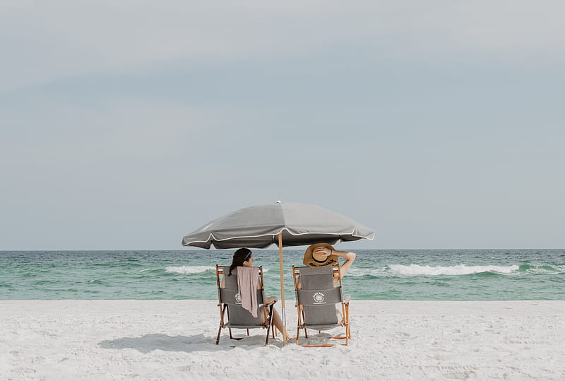 two people under beach umbrella near shoreline, HD wallpaper