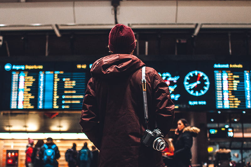 person looking up to the flight schedules, HD wallpaper