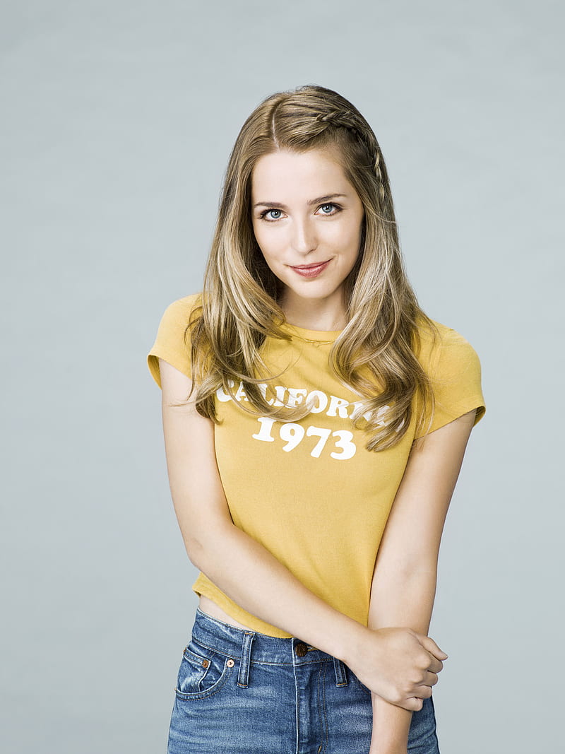 Jessica Rothe, women, actress, blue eyes, long hair, simple background, T-shirt, young woman, yellow tops, closed mouth, smiling, jeans, portrait, blue jeans, blue pants, HD phone wallpaper