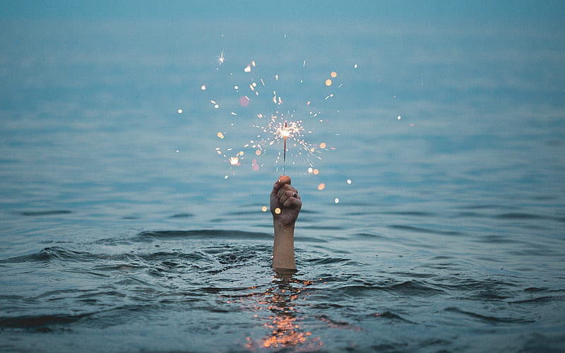 Person holding up a sparkler while underwater, water, people, fireworks, sparkler, blue, lake, underwater, firework, glow, sparkle, HD wallpaper