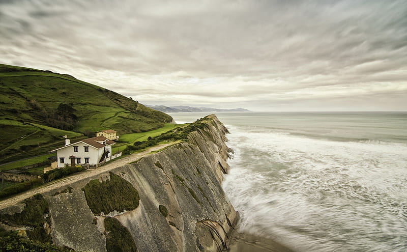 house behind protective coastal cliff, grass, houses, cliff, clouds, coast, sea, HD wallpaper