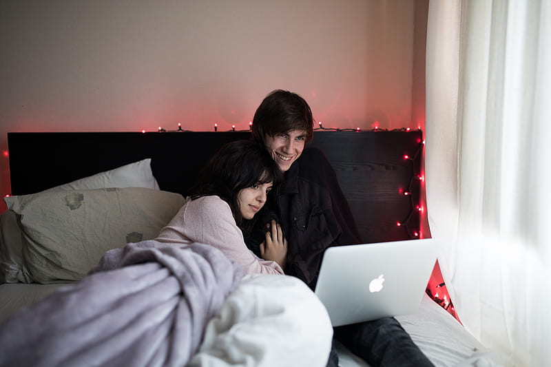couple on bed using MacBook Air beside of window with white curtain, HD wallpaper