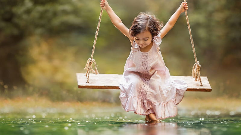 Cute Little Girl Is Wearing Light Peach Dress Riding On Swing Over River During Daytime Cute, HD wallpaper