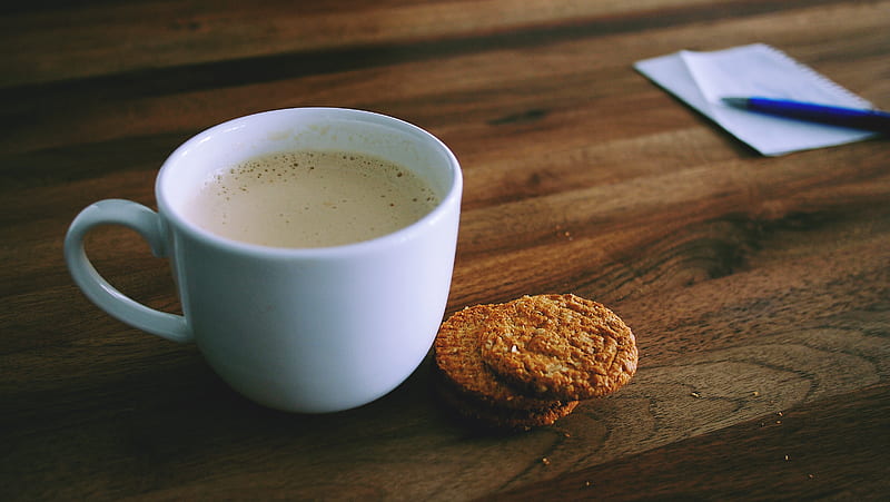 shallow focus graphy of white ceramic mug beside two baked cookies on brown wooden board, HD wallpaper