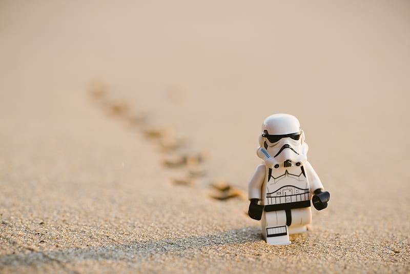 Stormtrooper minifigure walking on the sand, HD wallpaper