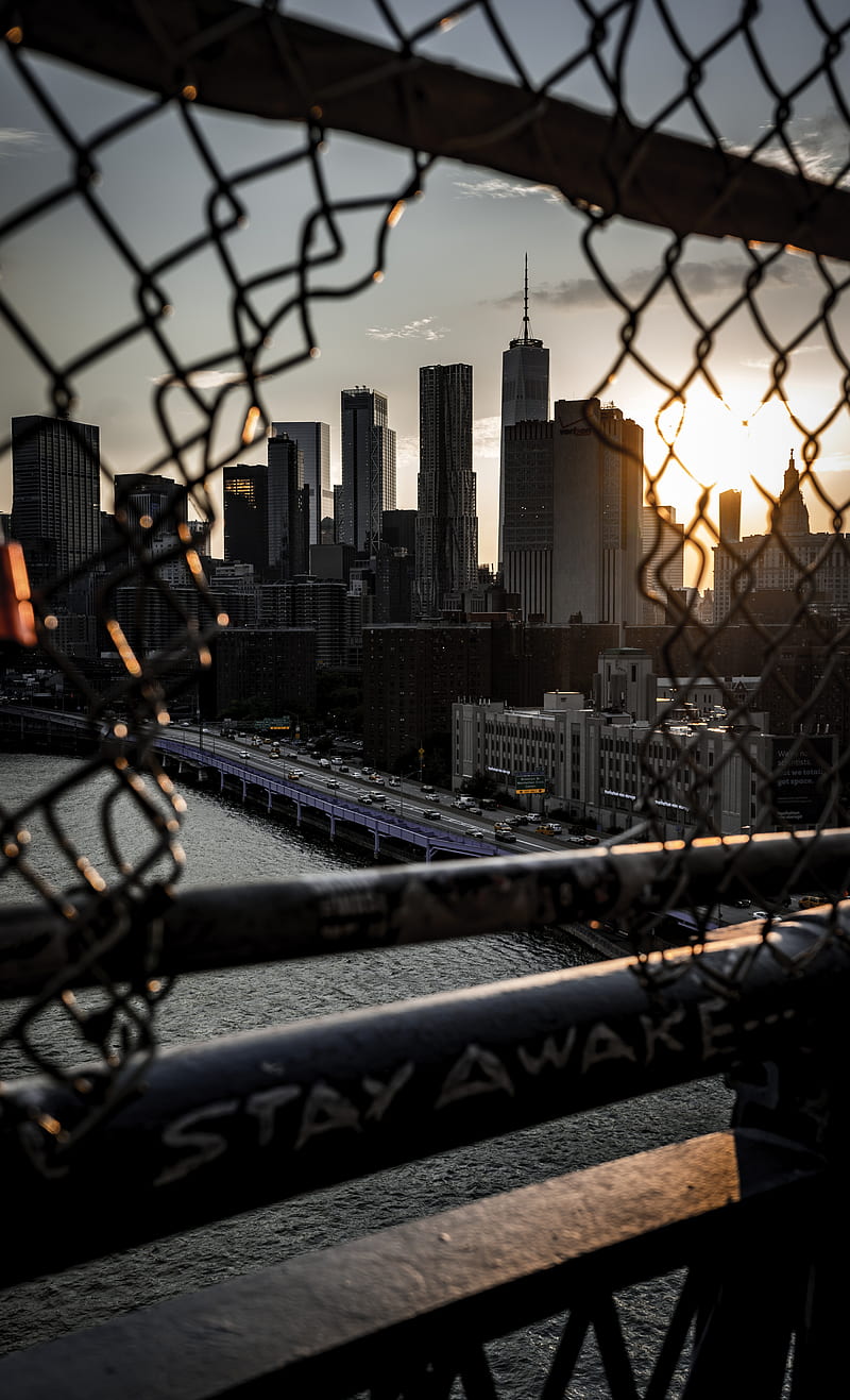 chain link fence overlooking high rise building, HD phone wallpaper