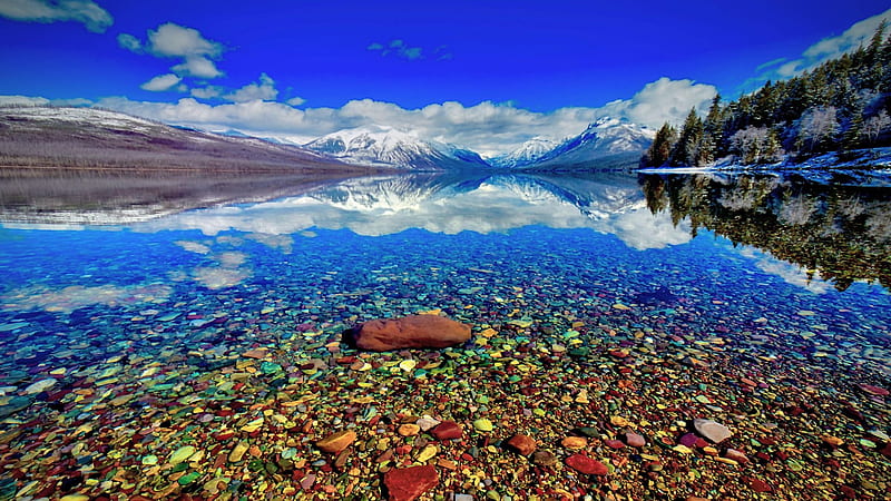 Lake McDonald, Glacier National Park, early spring, water, stones, usa, montana, mountains, sky, trees, reflections, clouds, HD wallpaper