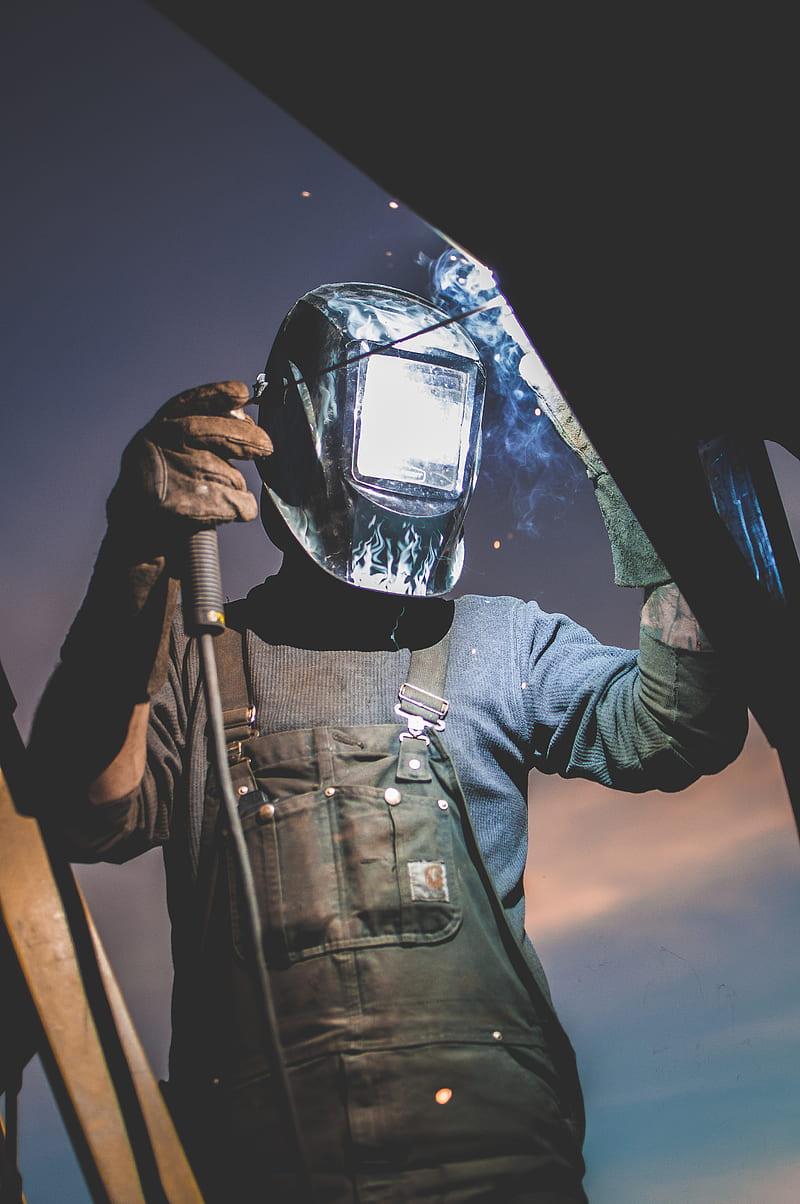man wearing automatic dark welding helmet, HD phone wallpaper