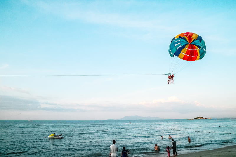Person Riding Parachute Above Ocean, HD wallpaper