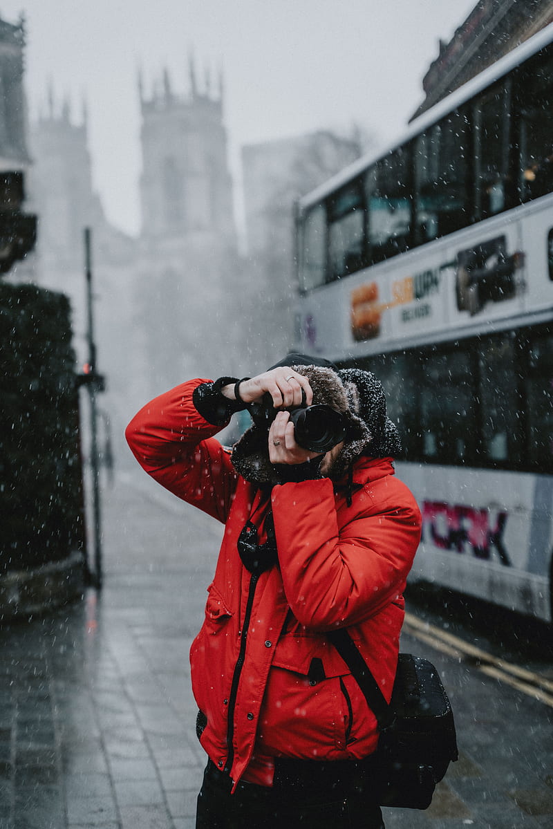 person in red jacket holding black dslr camera, HD phone wallpaper