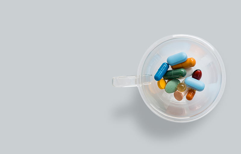green and white medication pill in clear glass jar, HD wallpaper