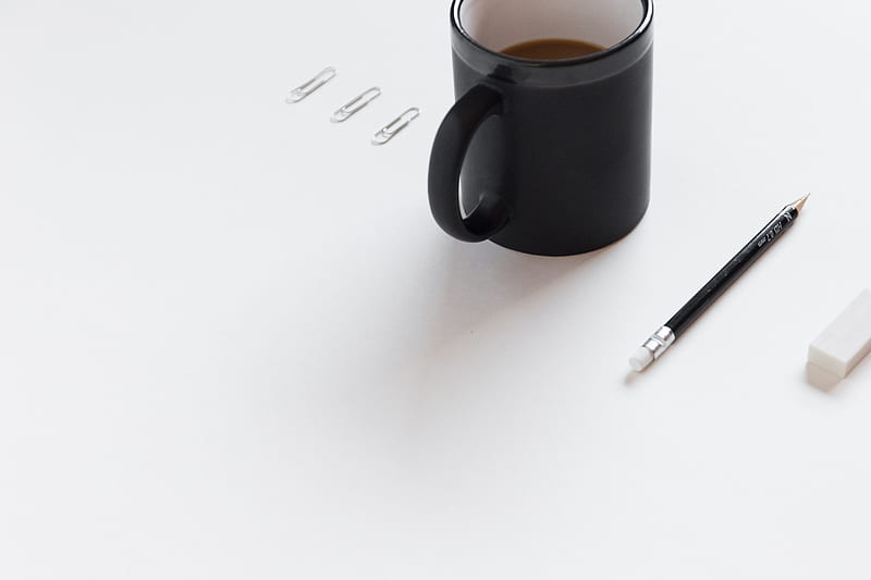 three white paper clips, black ceramic mug, black pencil, and white pencil eraser on white surface, HD wallpaper
