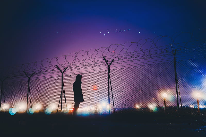 Night Lights Person Standing Behind Fence Silhouetee, person, alone, silhouette, graphy, HD wallpaper