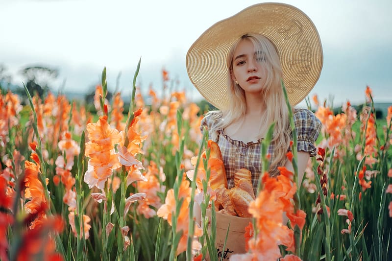 Blonde Posing in a Field of Gladiolus, hat, flowers, blonde, model, basket of bread, HD wallpaper