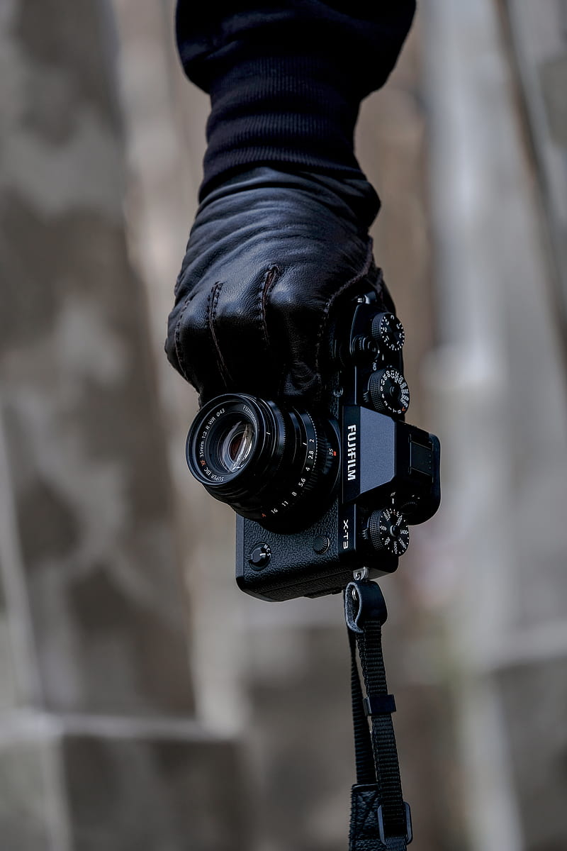 person's hand holding black Fujifilm bridge camera, HD phone wallpaper