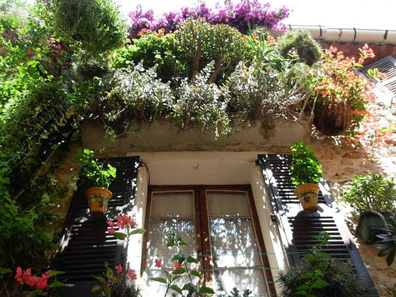 View from below, spanish house, flowers, window, pavement view, HD ...