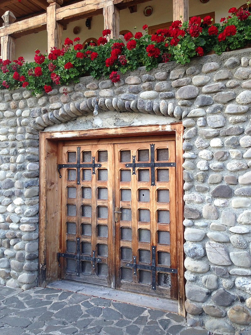 Wooden doors, brick, doors, flowers, old, rock, village, vintage, walls, wood, HD phone wallpaper