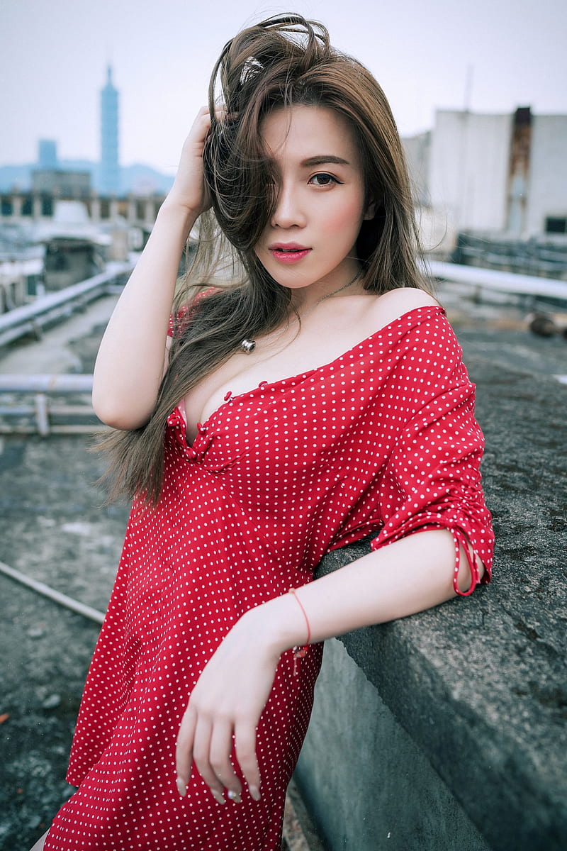 women, model, Asian, portrait display, vertical, brunette, holding hair, looking at viewer, parted lips, necklace, bare shoulders, cleavage, dress, polka dots, depth of field, rooftops, outdoors, women outdoors, HD phone wallpaper