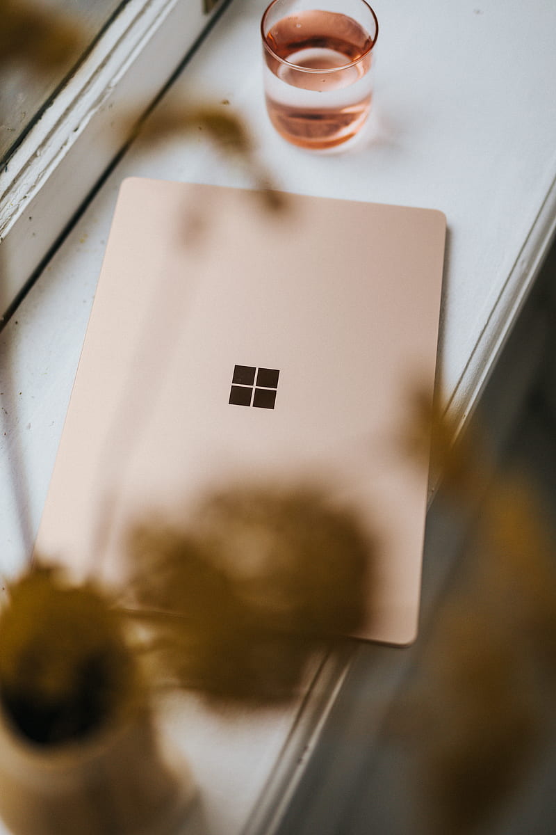 Sandstone coloured Surface Laptop on a window ledge, HD phone wallpaper