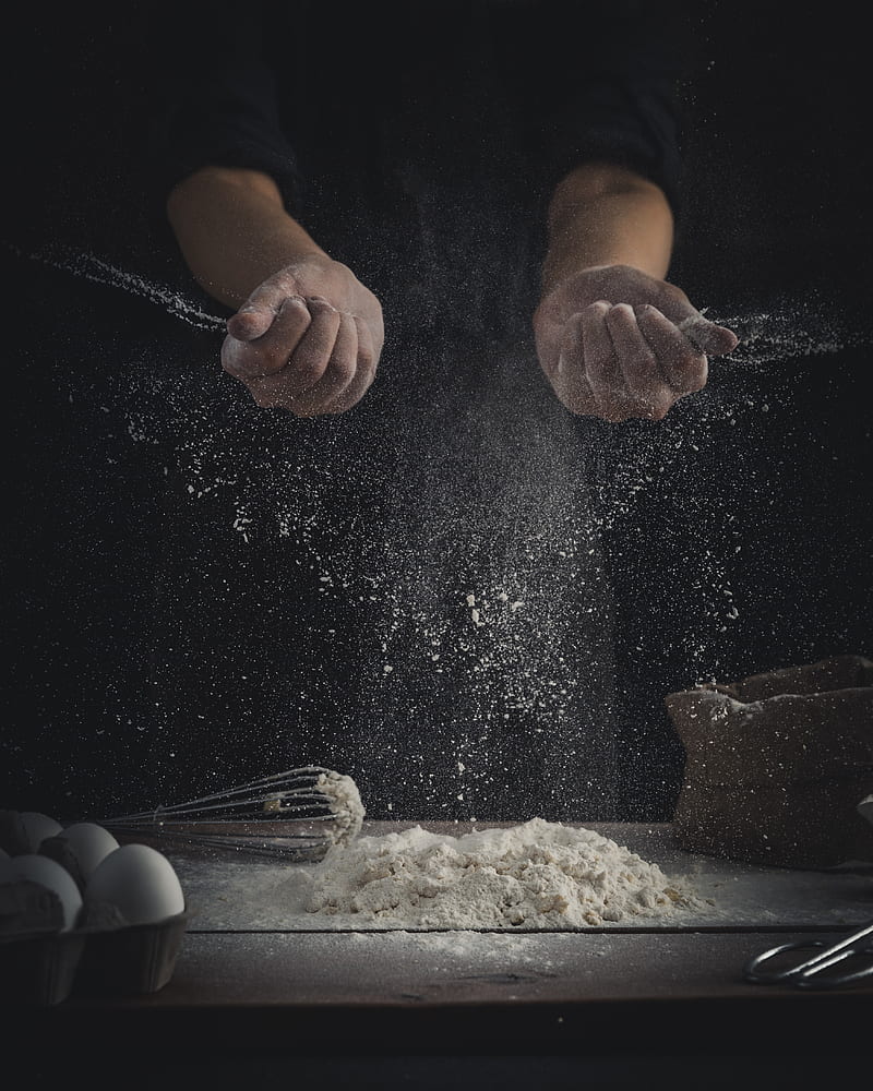person pouring flour on table beside eggs and whisk, HD phone wallpaper