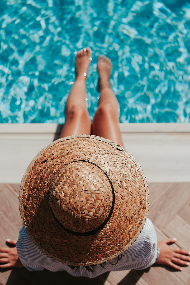 woman sitting on poolside setting both of her feet on pool, HD phone wallpaper