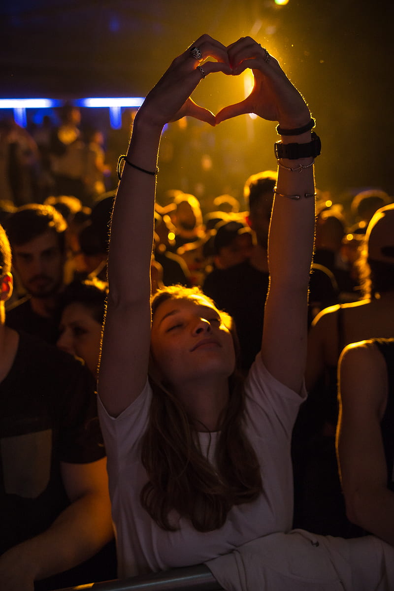 woman at crowd raising her hand while making heart sign, HD phone wallpaper