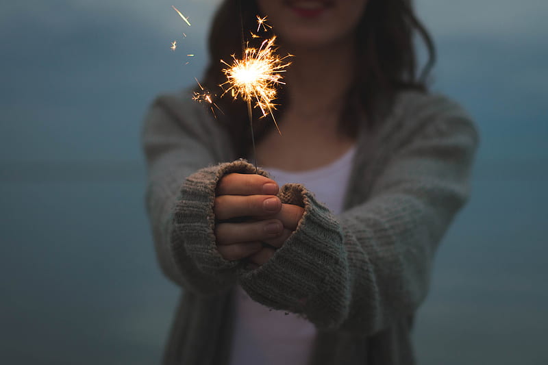 focus of a woman holding sparklers, HD wallpaper