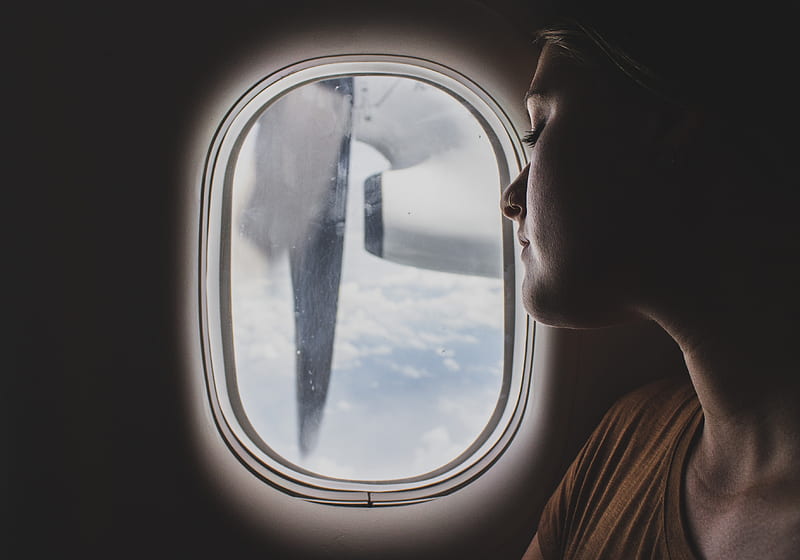 woman wearing brown scoop-neck sitting near airplane window while sleeping during flight, HD wallpaper