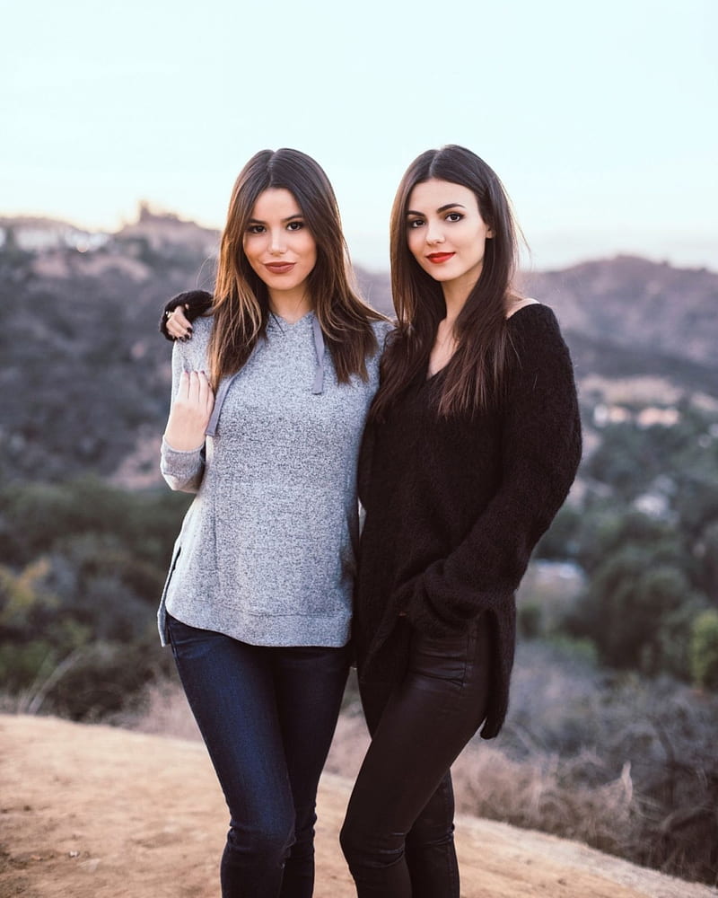 Victoria Justice, women, actress, brunette, long hair, Latinas, outdoors, two women, depth of field, hill, nature, Madison Reed, leather pants , straight hair, black clothing, sweater, Black clothes, standing, black sweater, sweatshirts, hands in pockets, celebrity, young woman, black pants, closed mouth, Victoria, HD phone wallpaper