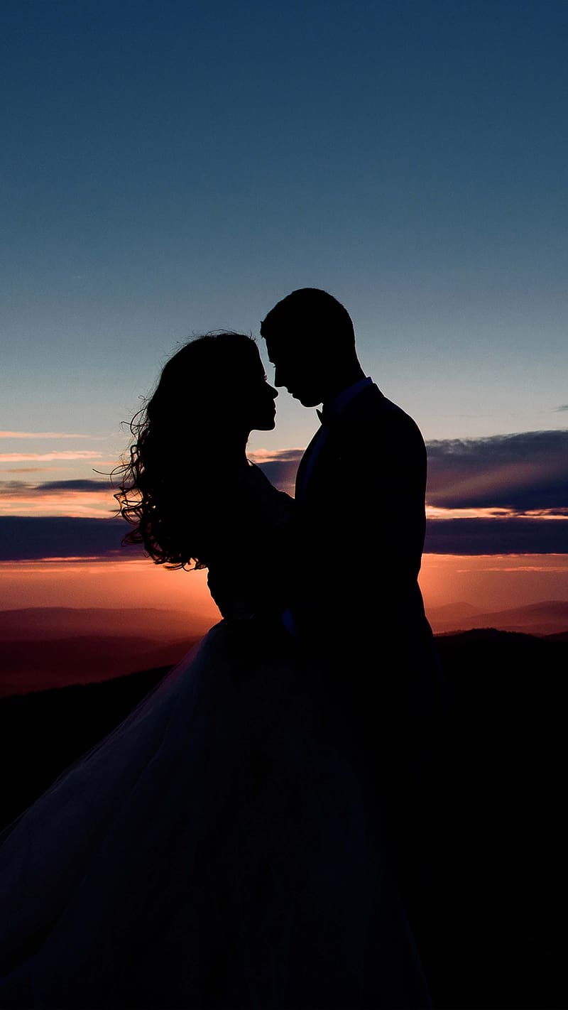 Download Husband And Wife Forehead Kiss Sunset Wallpaper | Wallpapers.com