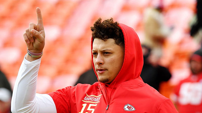 patrick mahomes is showing hand sign wearing head covered red tshirt in blur background sports-, HD wallpaper
