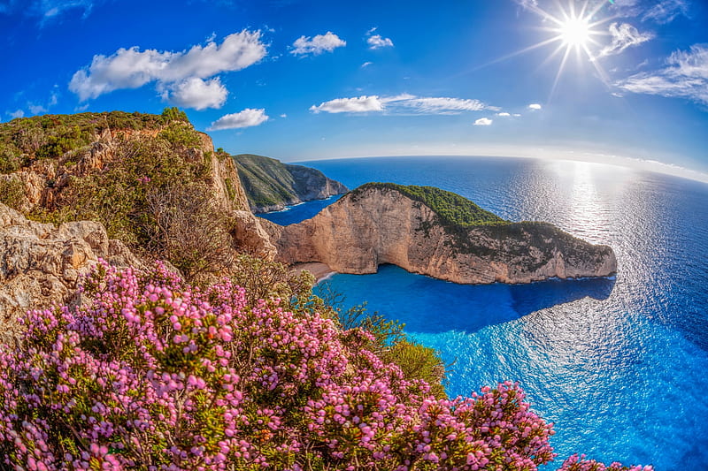 Navagio bay, sun, view, Navagio, cliifs, bonito, sky, beach, Greece, Zakynthos, water, cliffs, rays, wildflowers, bay, coast, blue, HD wallpaper