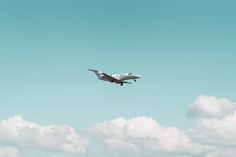 white airplane flying under Cumulus clouds, HD wallpaper