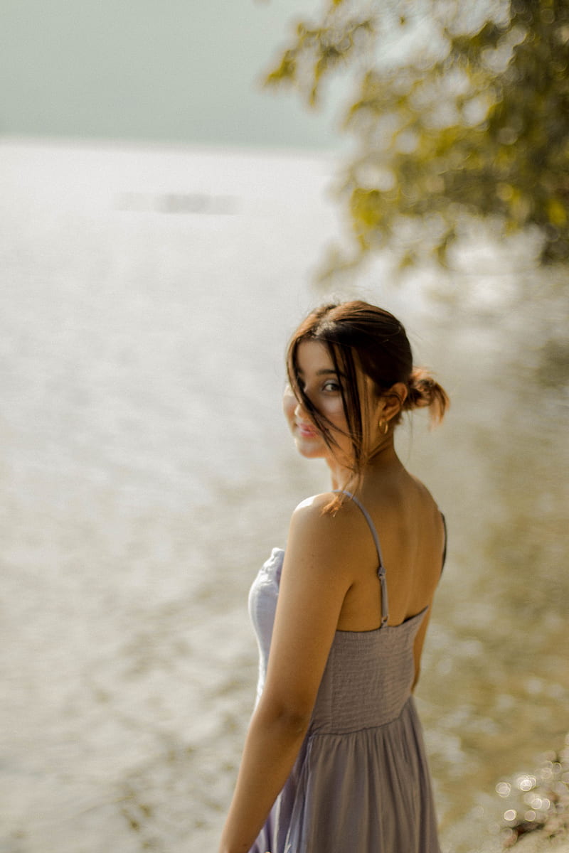 woman in white tank top standing near body of water during daytime, HD phone wallpaper